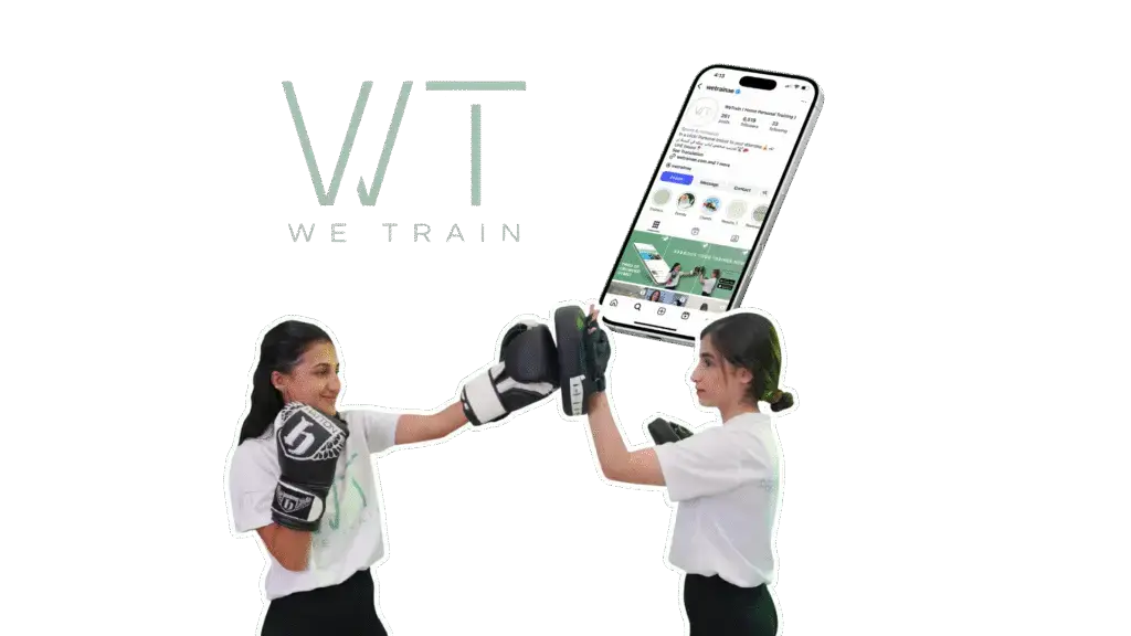 Two women boxing at a wellness event with WeTrain logo and Instagram profile, showcasing collaborations and social media management for wellness brands.