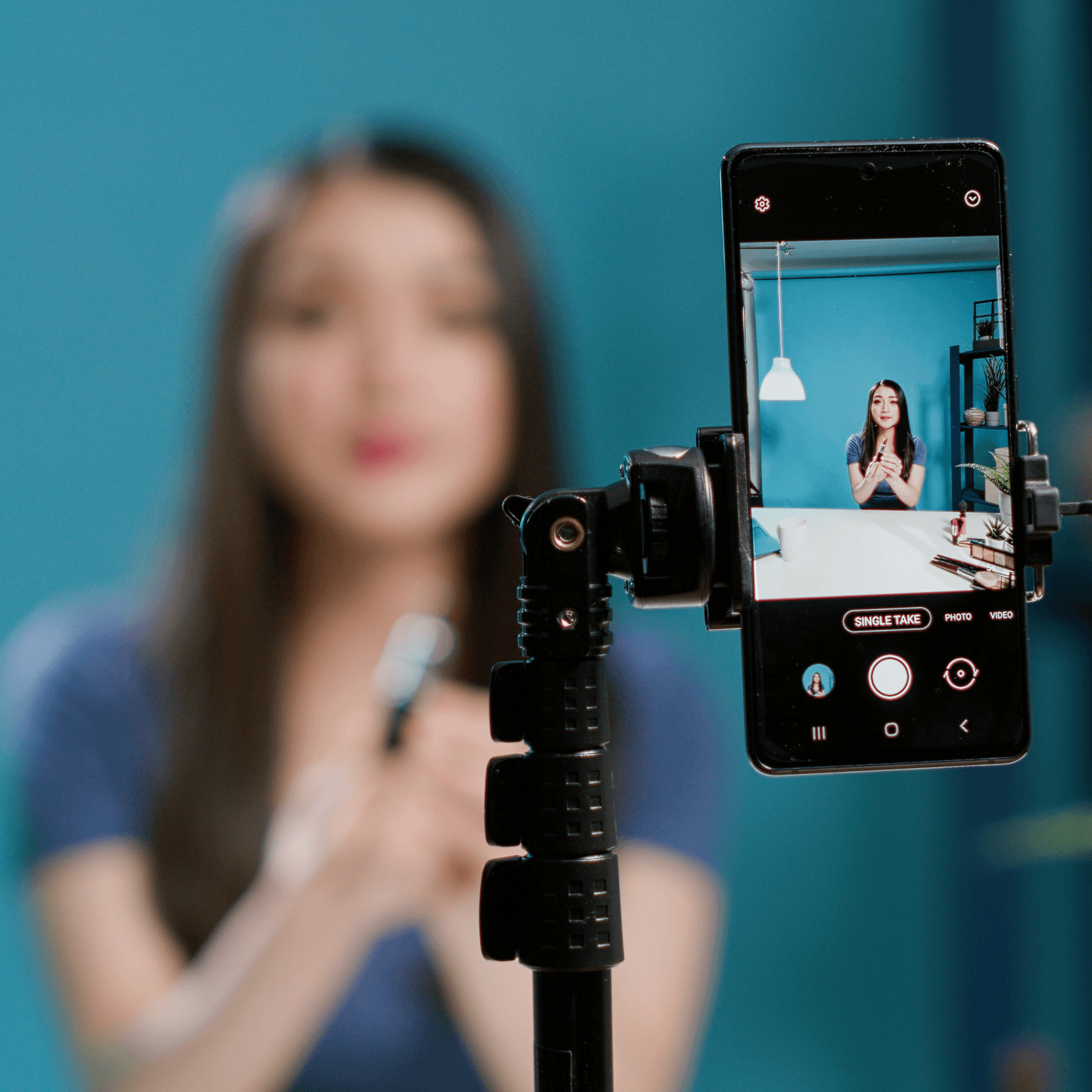 Content creator filming with smartphone for influencer marketing campaign